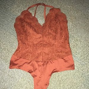 Burnt orange body suit lace with (really) open back.